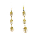 About Swirl Cowrie Shell Drop Earrings